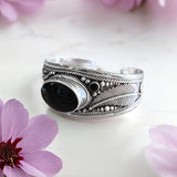 Brazalete de alpaca con mineral de ónix 